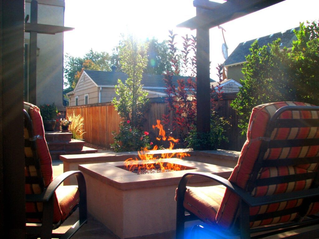 Outdoor firepit and seating area by Thunderbird Design in Denver, CO